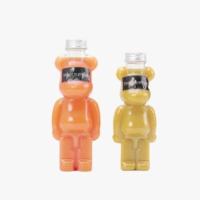 Clear 500ml bear shaped plastic bottles with aluminum lids for juice packaging