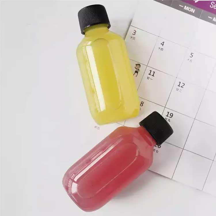 Custom sizes and shapes 60ml clear biodegradable juice bottles with screw caps