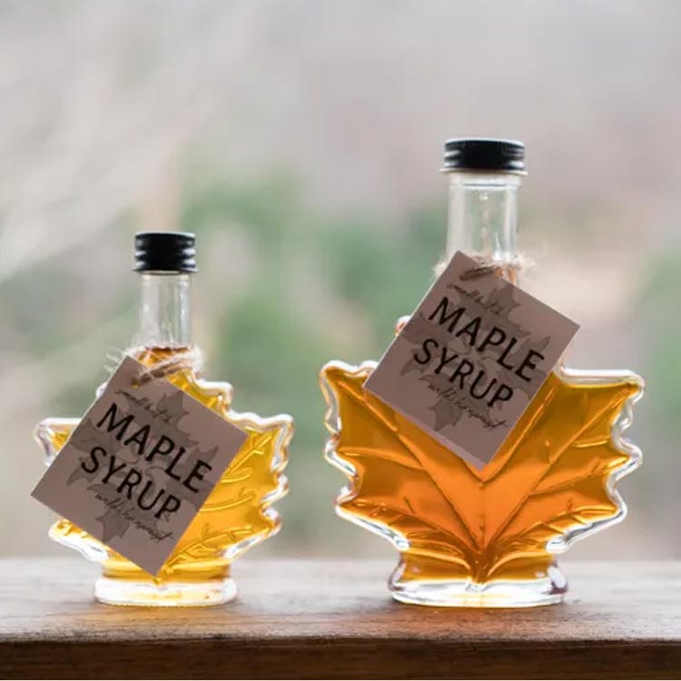 Wholesale empty 50ml 100ml glass maple leaf syrup bottle with aluminum screw lid for syrup honey