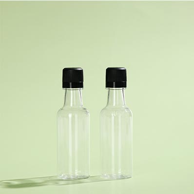 Wholesale clear 50ml mini plastic liquor bottles with caps