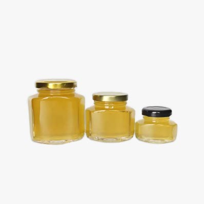 Wholesale clear 100ml glass hexagon honey jars with gold lids bulk