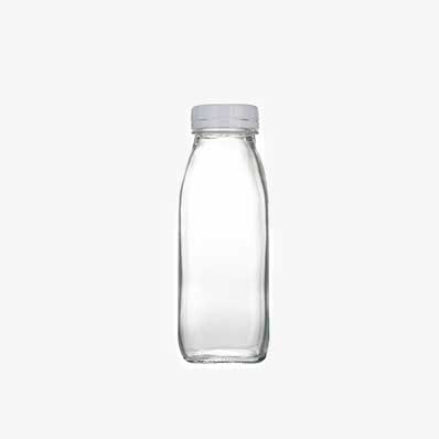 Wholesale clear 16oz square glass juice drink bottles with caps for juicing ginger whiskey