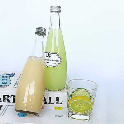 Factory price 750ml glass sparkling water bottle with caps wholesale