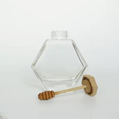 Bulk sale clear 500ml hexagon glass honey jar with dipper and lid