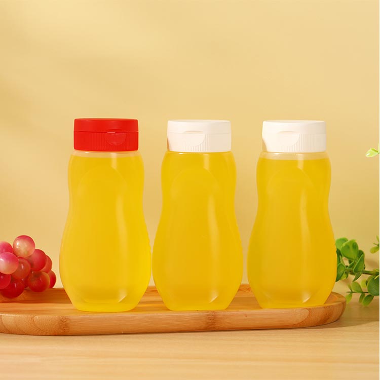 Food grade clear 330ml squeeze pet plastic honey bottles with flip top caps